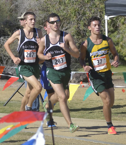 Palo Verde runners Noah Landers, left, and Andrew Goldsmith, center, compete with Bishop Man ...