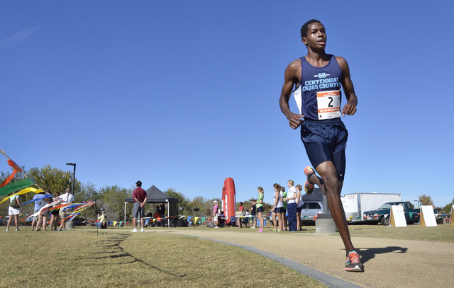Centennial’s Dajour Braxton begins the final leg of the Division I boys state cross co ...