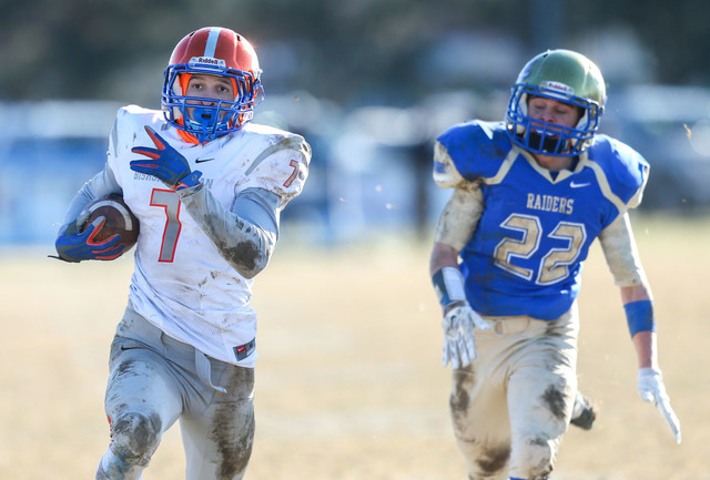 Bishop Gorman’s Biaggio Ali Walsh (7) rushes for a touchdown against Reed defender Log ...