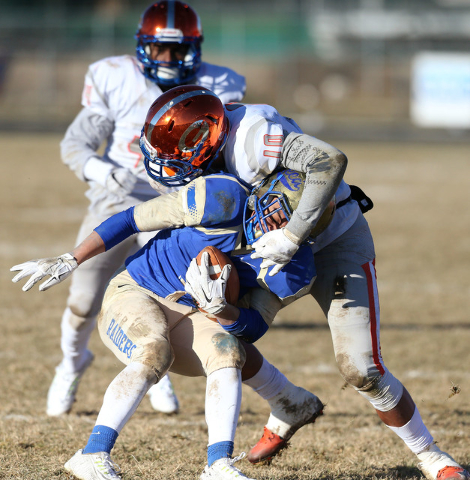 Bishop Gorman’s Palaie Gaoteote tackles Reed’s Jorden Carter in an NIAA Division ...