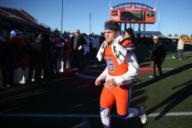 Bishop Gorman’s Tate Martell (18) runs to meet with his teammates after winning 84-8 a ...