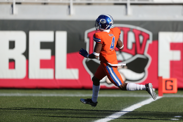 Bishop Gorman’s Alex Perry (4) runs the ball for a touchdown against Liberty during th ...