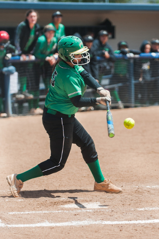 Rancho’s Yvette Sanchez (15) hits a Spanish Springs pitch during NIAA DI softball cham ...