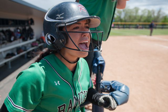 Kat Anthony (27) , catcher for Rancho, cheers on teammates from the dugout as they play Span ...