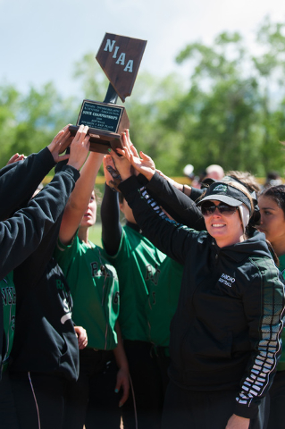 Amanda Zunno, Rancho head coach, holds up the second place trophy with her team after losing ...