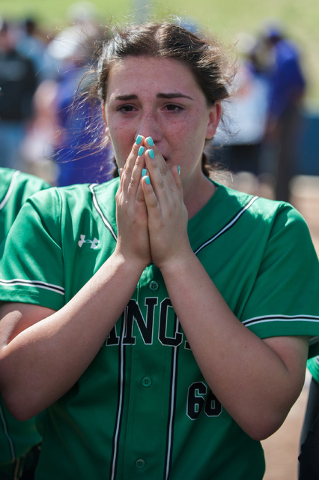 Gianna Carosone (66), Rancho shortstop, cries while talking with her teammates after losing ...