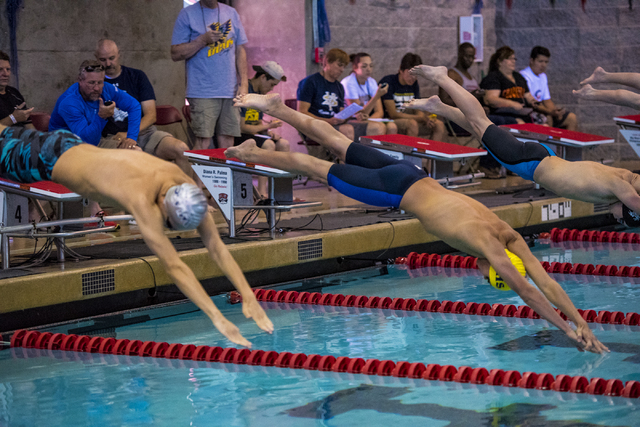 Amil Kurtagic, left, of Sierra High School, and Nick Lara, of Boulder City High School, dive ...