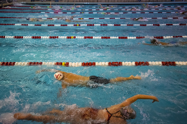 Swimmers warm up during Nevada High School State Championship swim meet at the Buchanan Nata ...