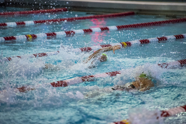 Abby Richter, center, of Green Valley High School swims during the Nevada High School State ...