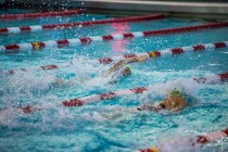 Abby Richter, center, of Green Valley High School swims during the Nevada High School State ...