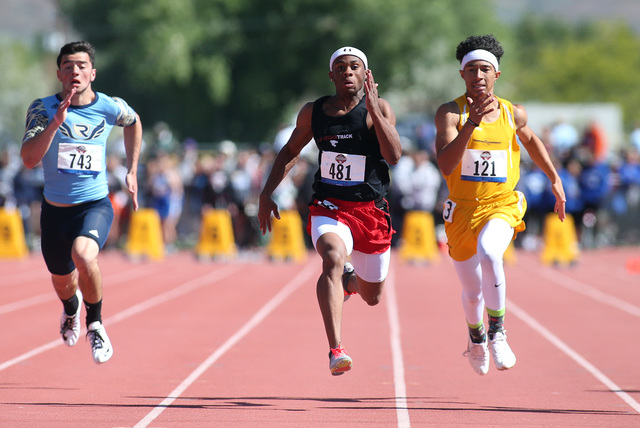 Las Vegas’ Tre James, center, takes second place in the DI 100 boys at the NIAA track ...