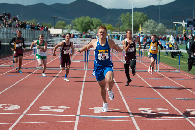 Moapa Valley’s RJ Hubert competes to win in 110 meter hurdles during the NIAA Division ...