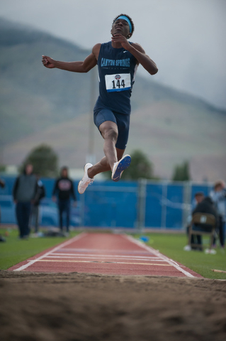 Canyon Springs’ Isaiah Johnson competes in boys long jump during the NIAA Division 1 s ...