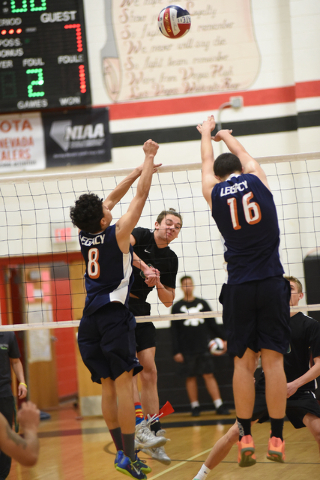 Palo Verde’s Parker Nelson (6) spikes the ball against Legacy’s Anthony Guevara ...