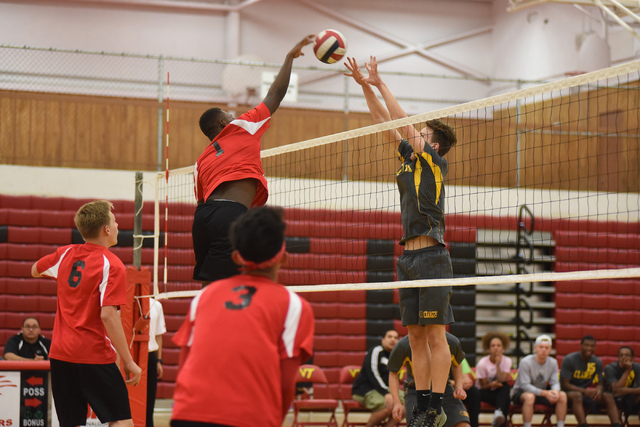 Tech’s Gary Johnson (1) spikes the ball against Clark’s Omar Catic (9) during th ...