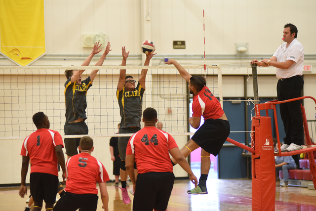 Tech’s Jesse Rojas (13) spikes the ball against Clark during their Division I-A state ...