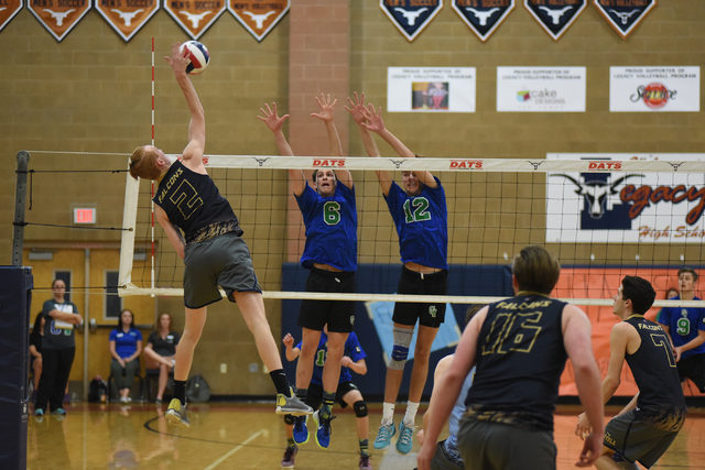 Foothill’s Mason Hanson (2) spikes the ball against Green Valley’s Zachary Hewit ...