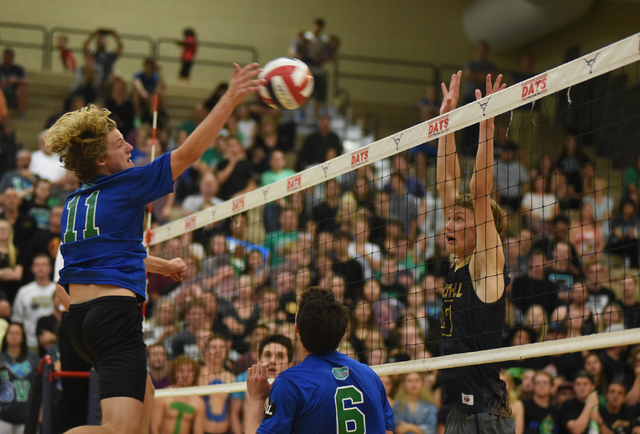 Green Valley’s Tanner Casto (11) spikes the ball against Foothill’s Zachary Thom ...