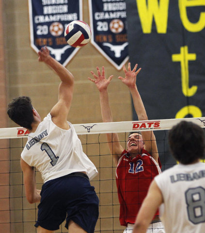 Legacy’s Tanner Compton (1) goes up for the kill over Valley’s Marty Heavey (12) ...