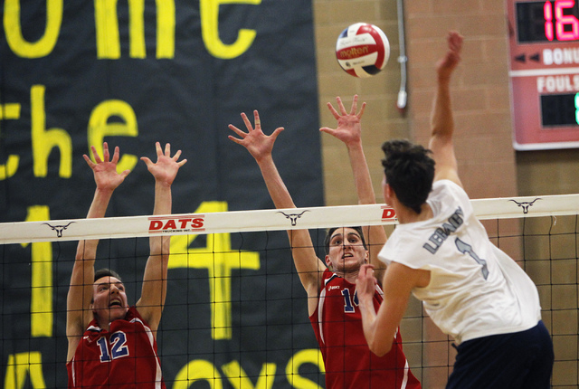 Legacy’s Tanner Compton (1) goes up for the kill over Valley’s Marty Heavey (12) ...