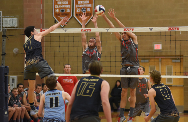 Foothill’s Eric Szukiewicz (7) spikes the ball against Arbor View’s Brenden Goug ...