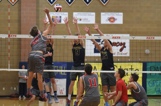 Arbor View’s Brenden Wagner (12) spikes the ball against Foothill’s Eric Szukiew ...