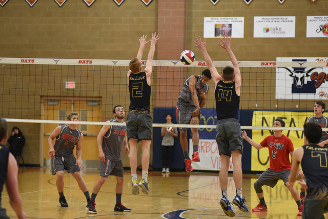 Arbor View’s Tyreese Cole (10), center, spikes the ball against Foothill’s Mason ...