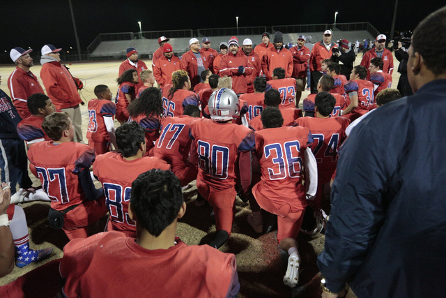 Liberty team members take a knee after winning the Sunrise Region championship Game on Frida ...