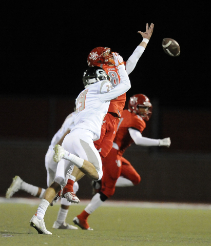 Arbor View tight end Austin Ferguson (83) is unable to haul in a pass while being covered by ...