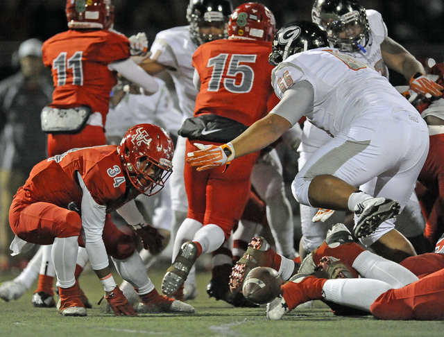 Arbor View running back Herman Gray (34) fumbles a handoff against Bishop Gorman during the ...