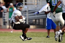 Las Vegas High’s Elijah Hicks runs with the ball during a scrimmage against Green Vall ...