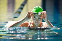 Senior Izzy Goldsmith of Palo Verde High School adjusts her goggles as she swims at the Pavi ...