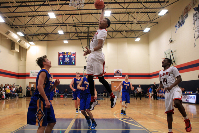 Las Vegas forward Tyler Bey sails in for a dunk against Orem at the Tarkanian Classic on Thu ...