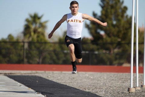 Faith Lutheran runner Mark Rubalcaba, 18, works on his long jumps during a track practice at ...