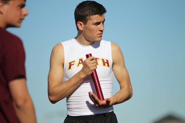 Faith Lutheran runner Mark Rubalcaba, 18, looks at his teammates during a track practice at ...