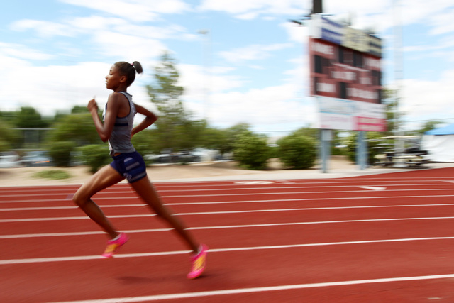 Centennial freshman Alexis Gourrier runs away from the pack in the 1600 meter run during the ...