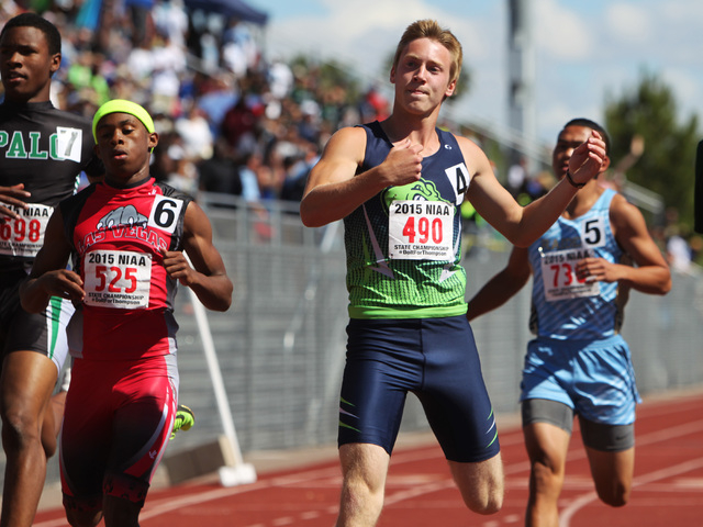 Green Valley sprinter Ian Mack wins the 100 meter dash during the Nevada NIAA state track me ...
