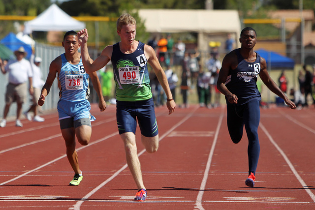 Green Valley sprinter Ian Mack wins the 100 meter dash during the Nevada NIAA state track me ...