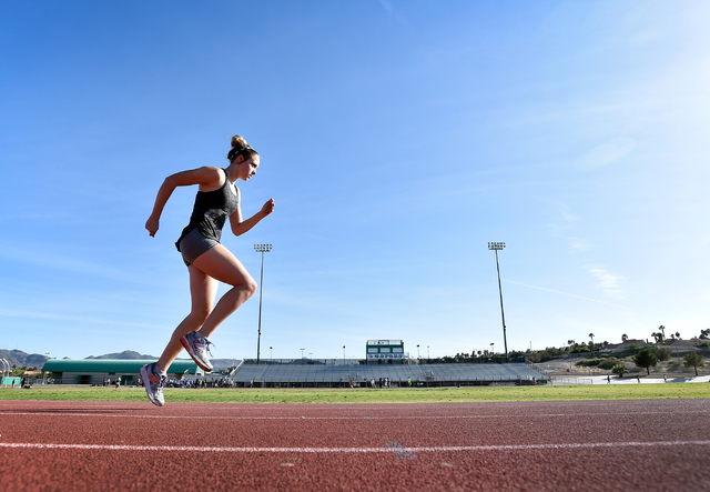 Sprinter Charleen Jordan warms up during track practice at Green Valley High School Tuesday, ...