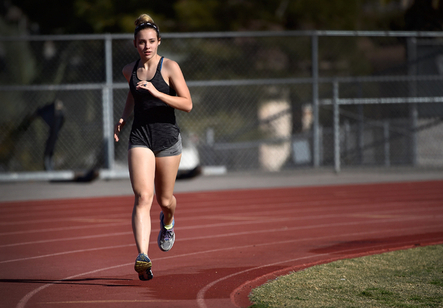 Sprinter Charleen Jordan warms up during track practice at Green Valley High School Tuesday, ...
