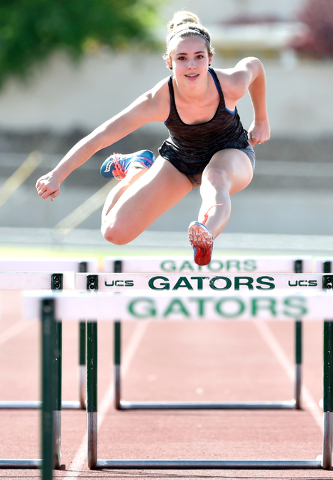Sprinter Charleen Jordan clears a hurdle during track practice at Green Valley High School T ...