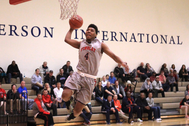 Findlay Prep guard Allonzo Trier leaps to dunk against Westwind during their game Tuesday, N ...