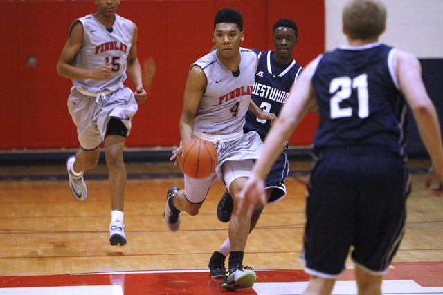 Findlay Prep guard Allonzo Trier takes the ball up court against Westwind during their game ...