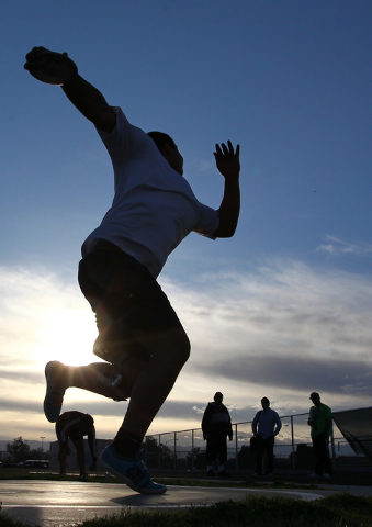 Liberty senior Reno Tu’ufuli, shown practicing Tuesday, has the third-best discus throw in ...