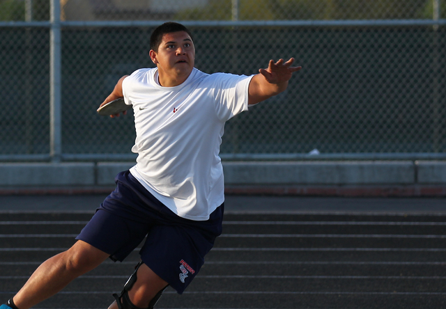 Liberty senior Reno Tu’ufuli, shown practicing Tuesday, has the third-best discus throw in ...