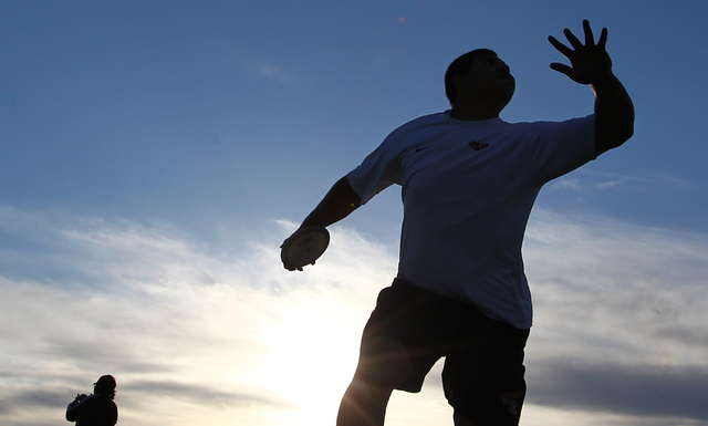 Liberty senior Reno Tu’ufuli, shown practicing Tuesday, has the third-best discus throw in ...