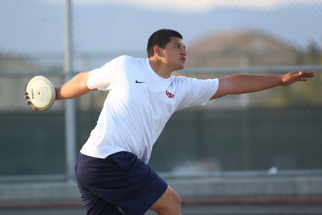 Liberty senior Reno Tu’ufuli, shown practicing Tuesday, has the third-best discus throw in ...