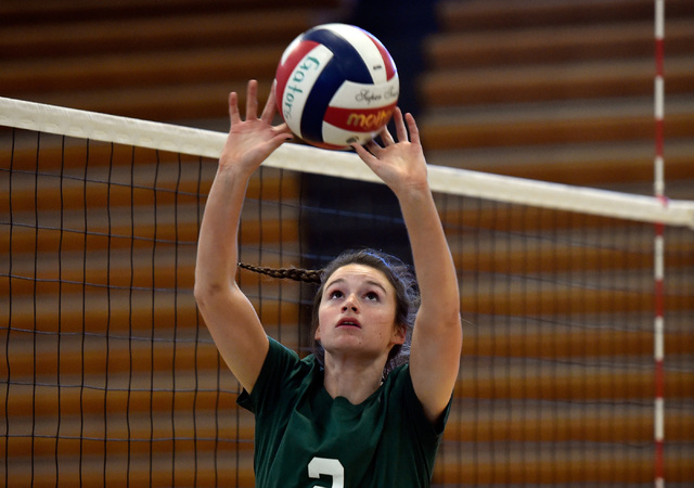 Senior Carlee Becker sets the ball during volleyball practice at Green Valley High School Tu ...