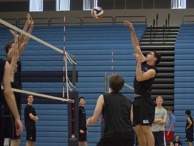 Tyler Jacob (15) hits the ball during volleyball practice at Foothill High School in Henders ...