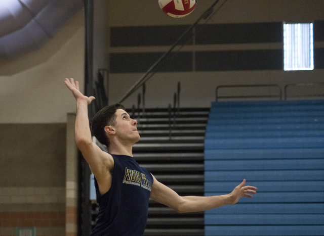 Eric Szukiewicz (7) serves the ball during volleyball practice at Foothill High School in He ...